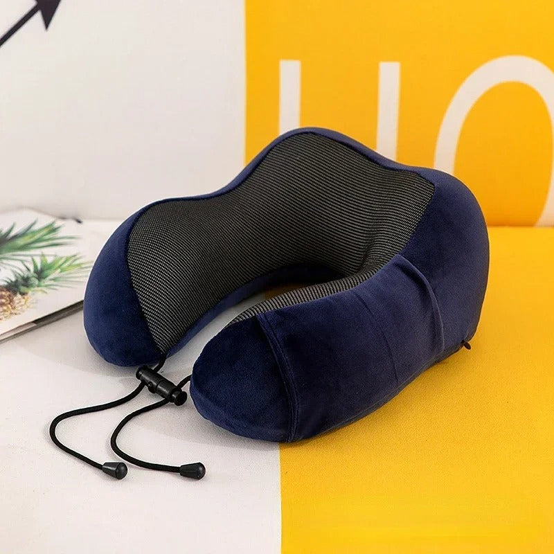 Blue travel neck pillow on a yellow surface with a magazine in the background