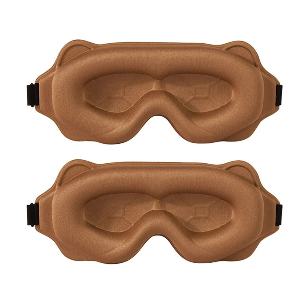 Two brown sleep masks on a white background