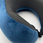 Blue travel neck pillow with black strap on a white background